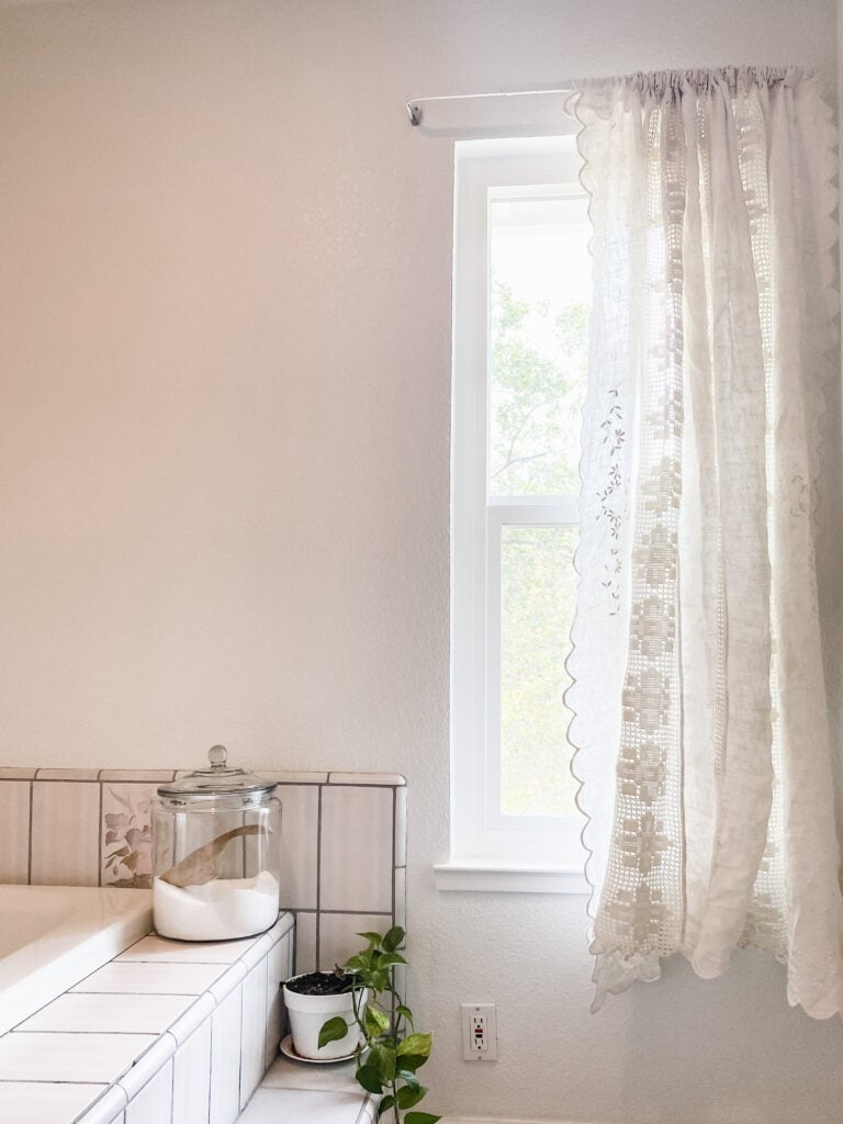 DIY linen curtains hanging in window of kitchen