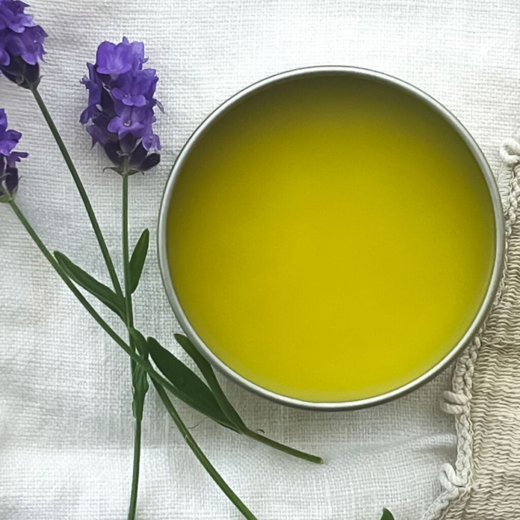 A single 2 oz metal pot filled with lavender salve.